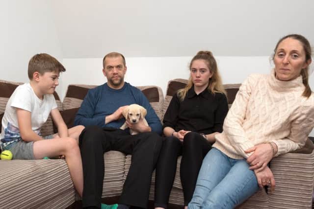 The Bingham family - Louis, 10, Kevin, Daisy, 15, Sophie with Barney the puppy Picture: Vernon Nash