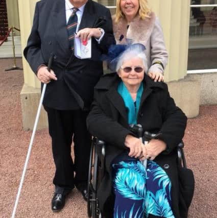 Michael Pipes with his wife June and daughter Debbie Johnson
at Buckingham Palace