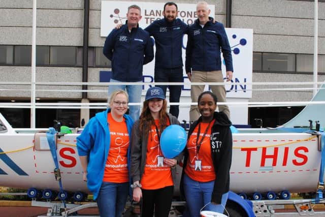 From left, rowers Nick Wright, Andy Williams and Andy Burns with members of the Over The Wall fundraising team