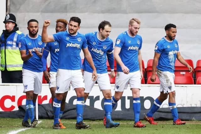 Gareth Evans celebrates with his Pompey team-mates. Picture: Joe Pepler
