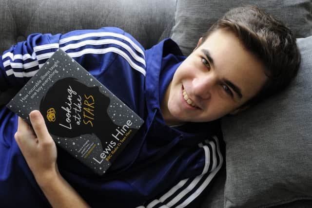 Lewis Hine with his new book 'Looking at the Stars' at his Havant home
Picture: Malcolm Wells (180328-2540)