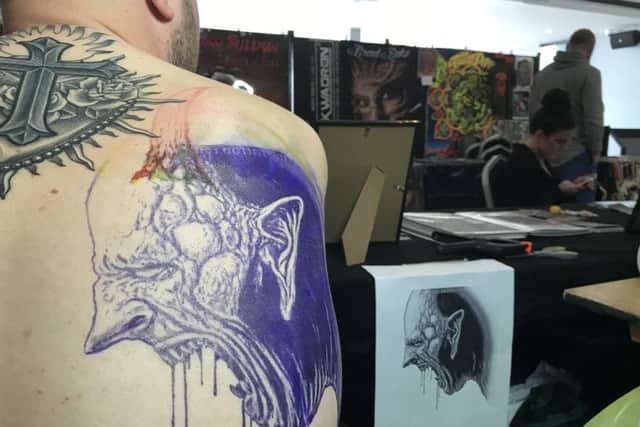Richard Lewis prepares to get tattooed by Shaun MaddyPicture: Byron Melton