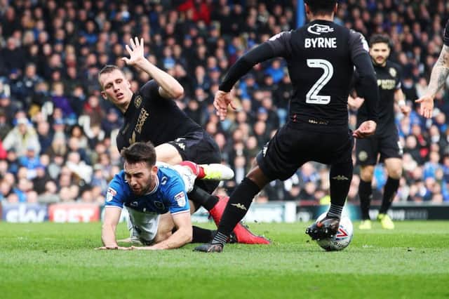 Ben Close is fouled by Dan Burn to win Pompey a penalty against Wigan. Picture: Joe Pepler