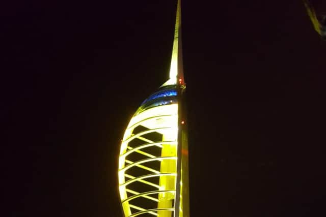 The Spinnaker Tower lit up gold to show its support for Autism Awareness Month. Picture: Julian Morgan