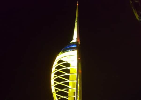 The Spinnaker Tower lit up gold to show its support for Autism Awareness Month. Picture: Julian Morgan