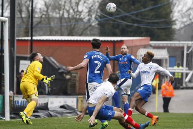 Matt Done nets an own goal for Rochdale to earn Pompey a 3-3 draw at Spotland. Picture: Daniel Chesterton/phcimages.com
