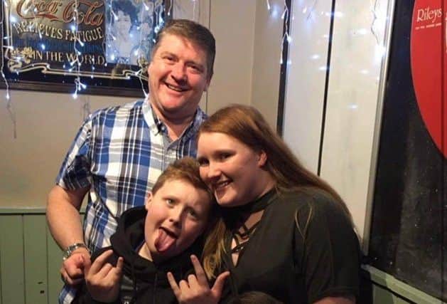 Chloe Reynolds, 15 (right) with her family