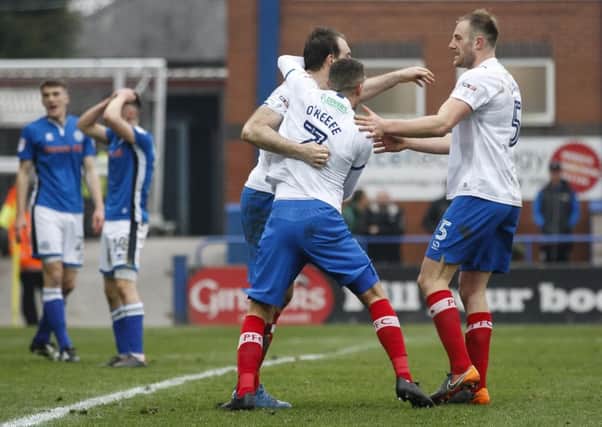 Pompey celebrate after Rochdale concede an own goal to make the score 3-3. Picture: Daniel Chesterton/phcimages.com