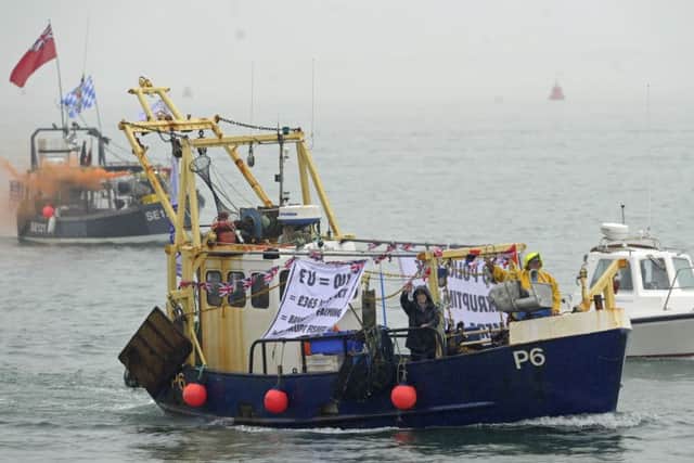 Local fishermen stage a waterborne protest against the EU outside Portsmouth Harbour.