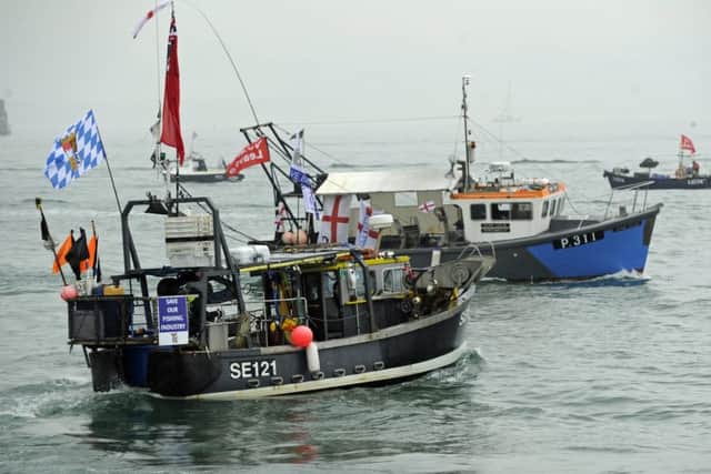 Local fishermen stage a waterborne protest against the EU outside Portsmouth Harbour.