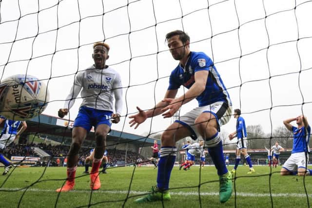 Jamal Lowe celebrates Matt Done's own goal at Rochdale. Picture: Daniel Chesterton/phcimages.com