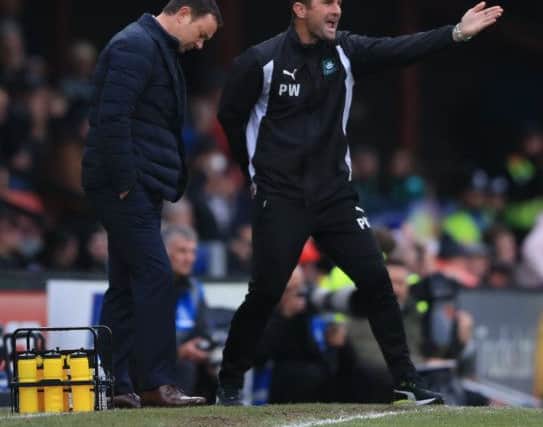 Plymouth Argyle's first-team coach Paul Wotton, right