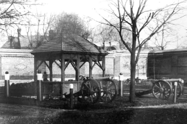 Surrounded by ships cannon topped with cannonballs,  here we see a porch inside HMS Vernon, now Gunwharf Quays. Does anyone know what its purpose was?