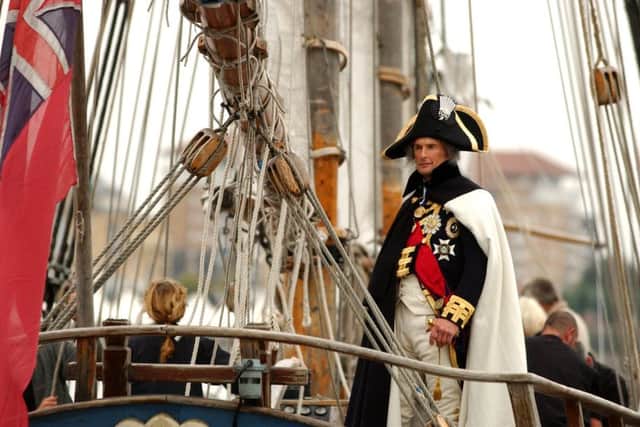 The latePortsmouth based actor Alex Naylor sailing up the River Thames as Lord Nelson on a replica of HMS Pickle, the ship which brought the news of victory at Trafalgar and the death of Nelson.