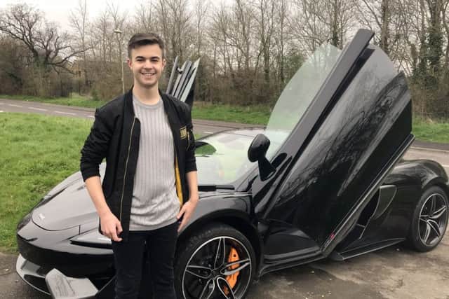 Lewis Hine with the sports car he arrived at his book signing session in yesterday
