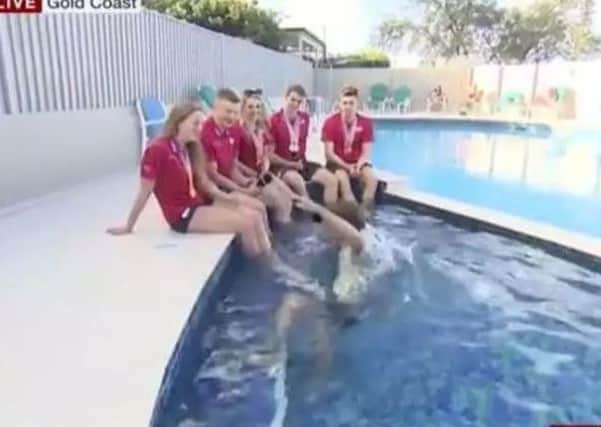 BBC presenter Mike Bushell falling into a swimming pool during a live interview at the Commonwealth Games in Australia's Gold Coast. Picture: BBC