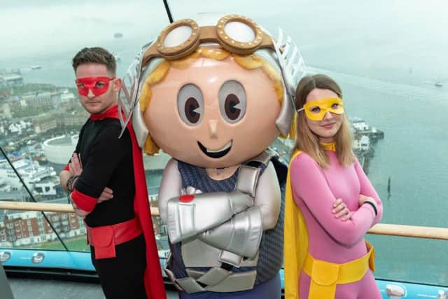 Pete Haslam as Captain Comic Con, Bryony Drew as Southsea Superwoman and Vugo, the Spinnaker Tower mascot. Picture: Riky Butcher / Portsmouth Guildhall / Spinnaker Tower / Vernon Nash