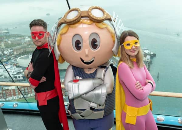 Pete Haslam as Captain Comic Con, Bryony Drew as Southsea Superwoman and Vugo, the Spinnaker Tower mascot. Picture: Riky Butcher / Portsmouth Guildhall / Spinnaker Tower / Vernon Nash