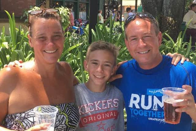 Darron Strange, right, with his wife Nicky, left, and son Jack, now 16, centre
