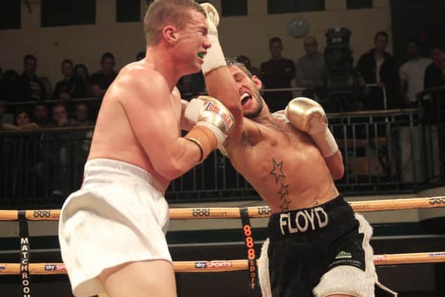 Floyd Moore catches Gary Buckland with an uppercut during their Prizefighter clash. Picture: Lawrence Lustig