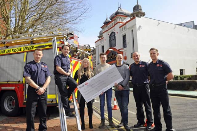 BIG THANK YOU Left to right, firefighter Tom Davies, Southsea Red Watch Manager Jamie Wren, Astoria staff Gemma Sands, Alistair Ritchie, Mark Rumbold, with firefighter James Errigo, and firefighter Alex McMahon Picture by:  Malcolm Wells (180411-4308)