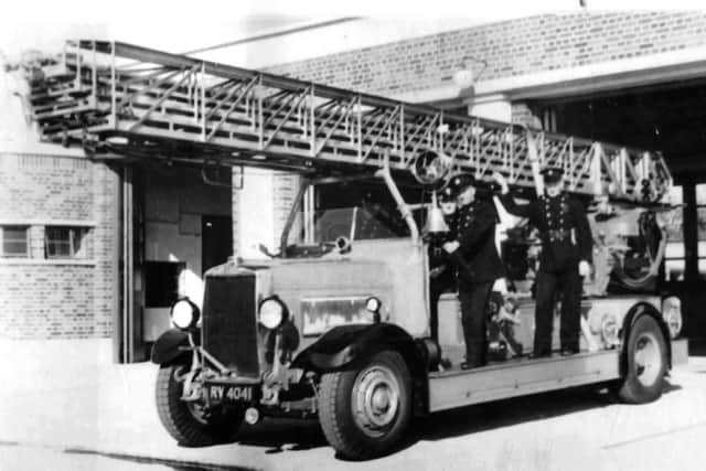 In days gone by every lad wanted to be a train driver or perhaps travel on the Portsmouth City Fire Brigade multi-laddered fire engine.  Picture: Barry Cox Collection