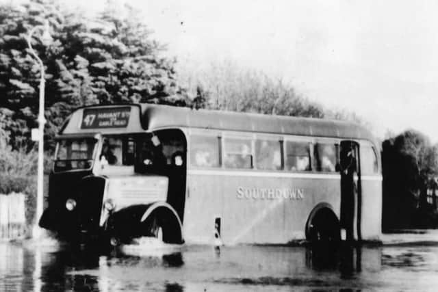 A Southdown bus ploughs through floodwater at Gable Head, Hayling Island. Picture: Roger Allen Collection