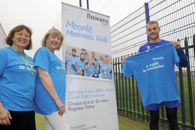 Denise Fry and Teresa Jeffery from The Rowans Hospice with Pompey player Jack Whatmough
Picture: Malcolm Wells (180412-4485)