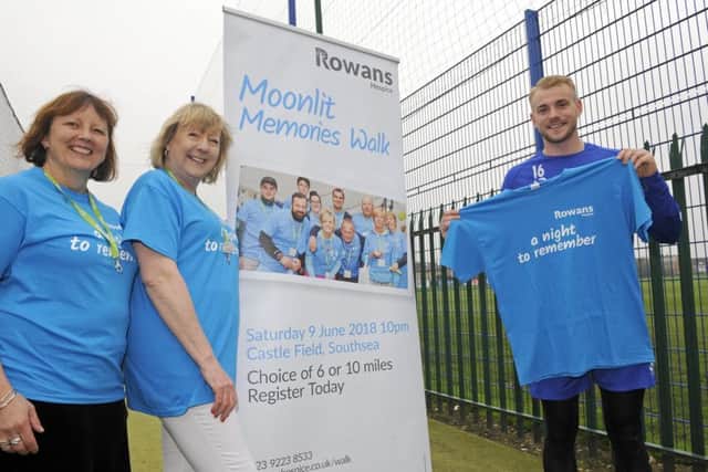 Denise Fry and Teresa Jeffery from The Rowans Hospice with Pompey player Jack Whatmough 

Picture: Malcolm Wells (180412-4485)