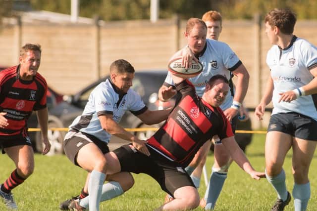 Harry King is tackled. Picture: Keith Woodland