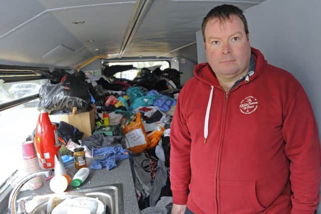 Alistair Thompson inside the vandalised homeless bus
