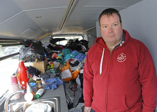 Alistair Thompson inside the vandalised homeless bus