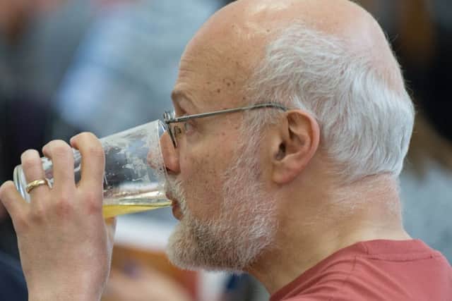 A punter at Portchester knocks back a glass