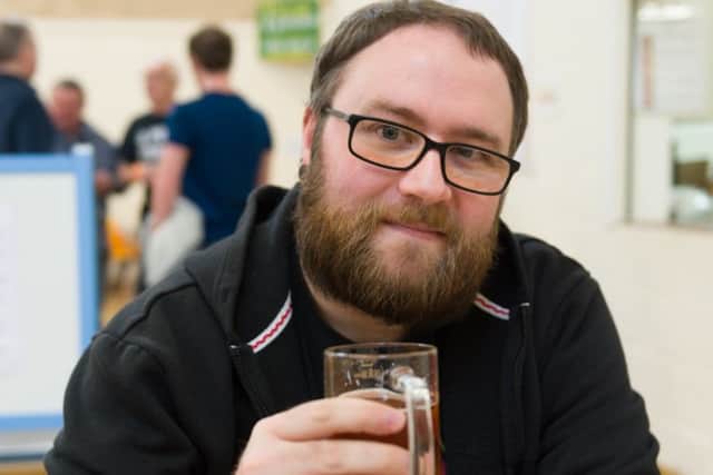 Gosport resident Mark Henderson enjoing a glass of 'English Garden' with a beef and ale pie at Wickham
(180338-008)