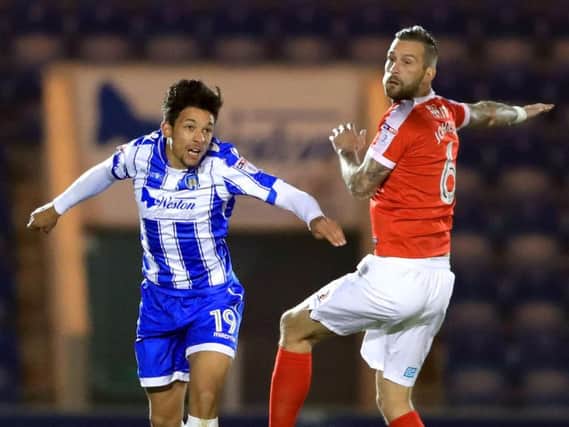 Macauley Bonne, left, in action for Colchester United earlier in his career