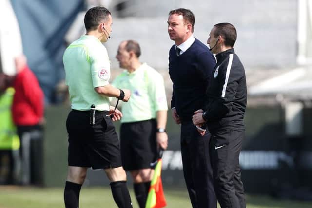 Plymouth boss Derek Adams confronts referee Dean Whitestone Picture: Joe Pepler