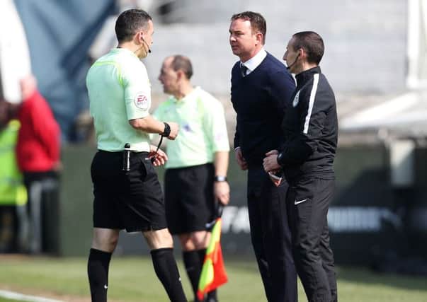 Plymouth boss Derek Adams confronts referee Dean Whitestone Picture: Joe Pepler