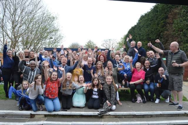 David Waterman, middle, celebrates completing the Marathon des Sables with his friends and family      Picture: David George