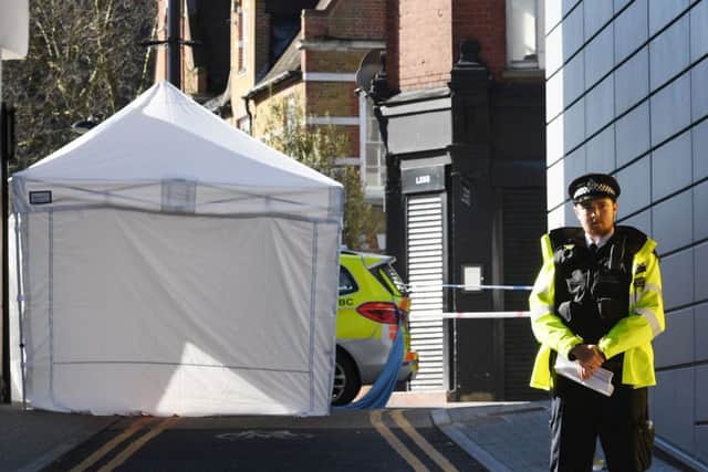 Police at the scene in Link Street, Hackney, east London after a man in his 20s died after being stabbed. Picture: Press Association