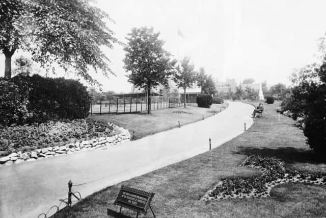 This was Victoria Park, Portsmouth, in the early part of the last century. The low wire fence was to stop people walking on the grass. 
At the bottom is a sign in block capitals with a request from the mayor.  It says: THE MAYOR REQUESTS THE ASSISTANCE OF THE INHABITANTS IN PROTECTING THE TREES.
I dont suppose such a sign would last five minutes today.  Picture: Barry Cox Collection