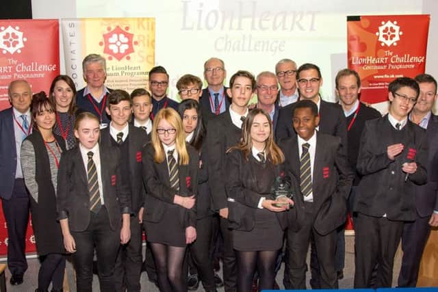 Staff from Helistrat alongside pupils from King Richard School