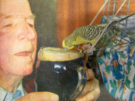 Ted Smith, 84, shares a pint of Watney's Brown Ale with his friend Billy