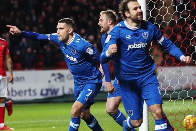 Stuart O'Keefe and Brett Pitman celebrate Pompey's league winner against Charlton