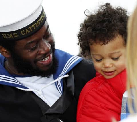 Leading Chef Emmanuel Craig with his son Payton Craig after returning on HMS Cattistock