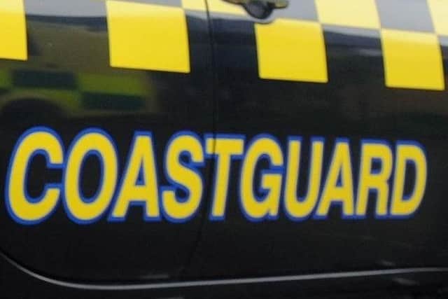 Three people were reported to be stuck in mud off Hayling Island