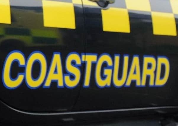 Three people were reported to be stuck in mud off Hayling Island