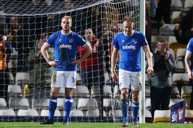 Jack Whatmough, Matt Clarke and Dion Donohue stunned after Pompey concede a second at Bradford. Picture: Joe Pepler/ PinPep