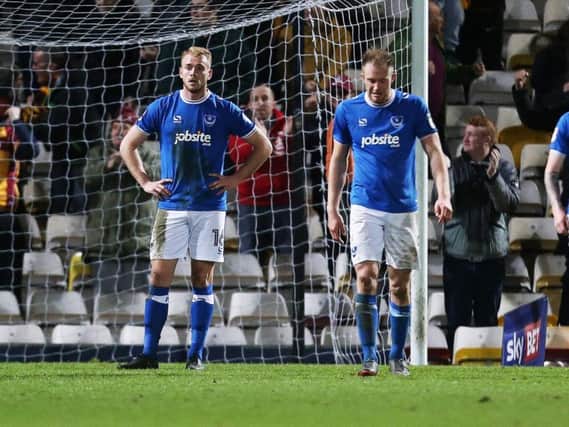 Jack Whatmough, Matt Clarke and Dion Donohue stunned after Pompey concede a second at Bradford. Picture: Joe Pepler/ PinPep