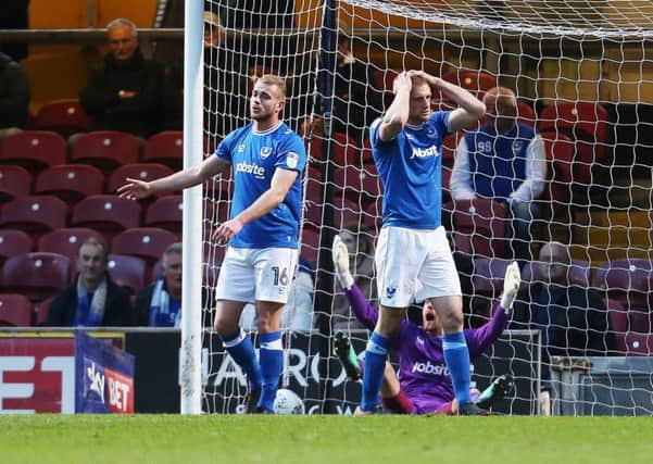 Jack Whatmough, Matt Clarke and Luke McGee show their frustration after Bradford opened the scoring. Picture: Joe Pepler