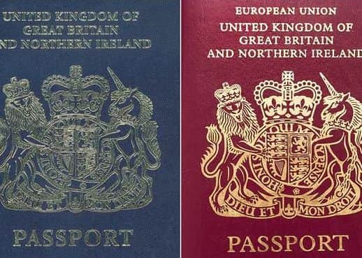 The original British blue passport, left, and the current burgundy one, right.